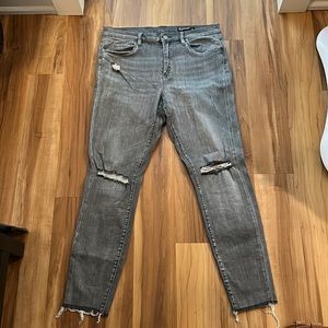 Grey distressed skinny jeans